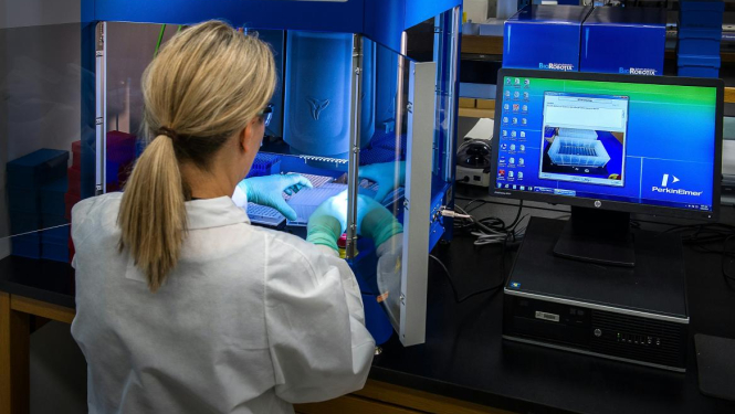 A woman does science. Image is for illustrative purposes only.