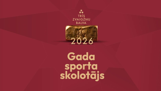 Uz tumšsarkana fona ar trīs zvaigznēm redzama balva - taisnstūra paralelograms no zeltam līdzīga materiāla, kā arī uzraksts "Trīs zvaigžņu balva 2026" un "Gada sporta skolotājs"