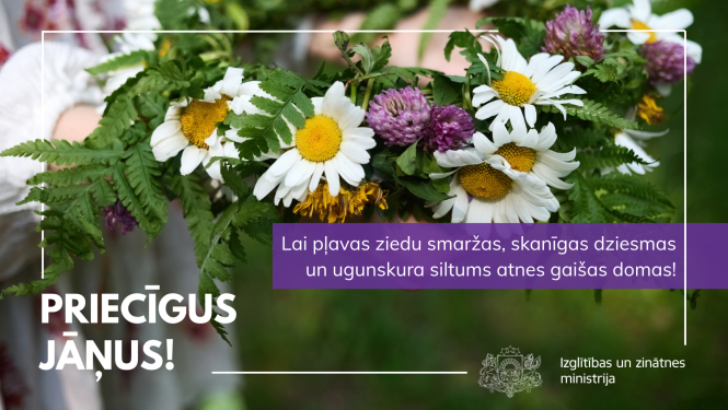 Ziedu vainags. Teksts - "Priecīgus Jāņus! Lai pļavas ziedu smaržas, skanīgas dziesmas un ugunskura siltums atnes gaišas domas!"