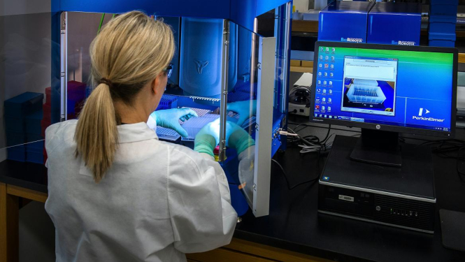 A woman does science. Image is for illustrative purposes only.