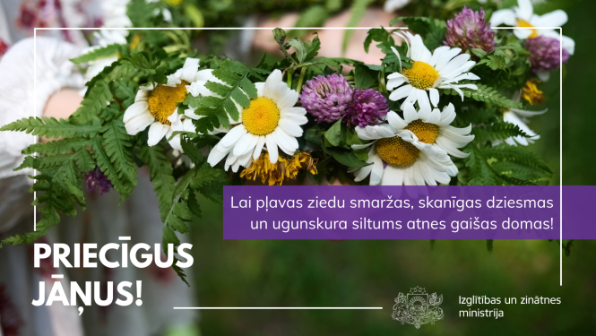 Ziedu vainags. Teksts - "Priecīgus Jāņus! Lai pļavas ziedu smaržas, skanīgas dziesmas un ugunskura siltums atnes gaišas domas!"