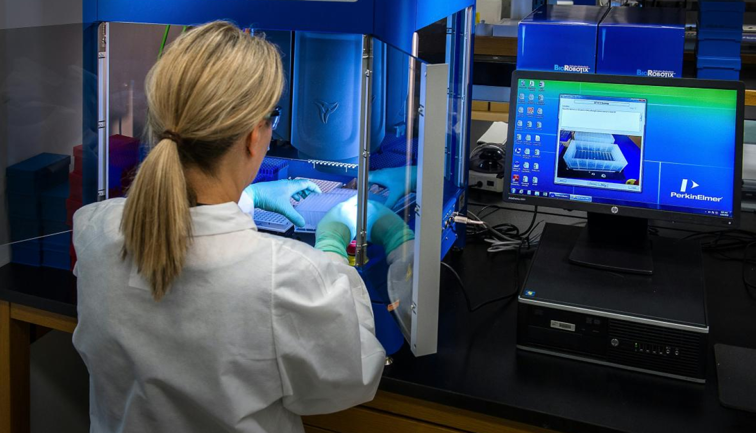 A woman does science. Image is for illustrative purposes only.